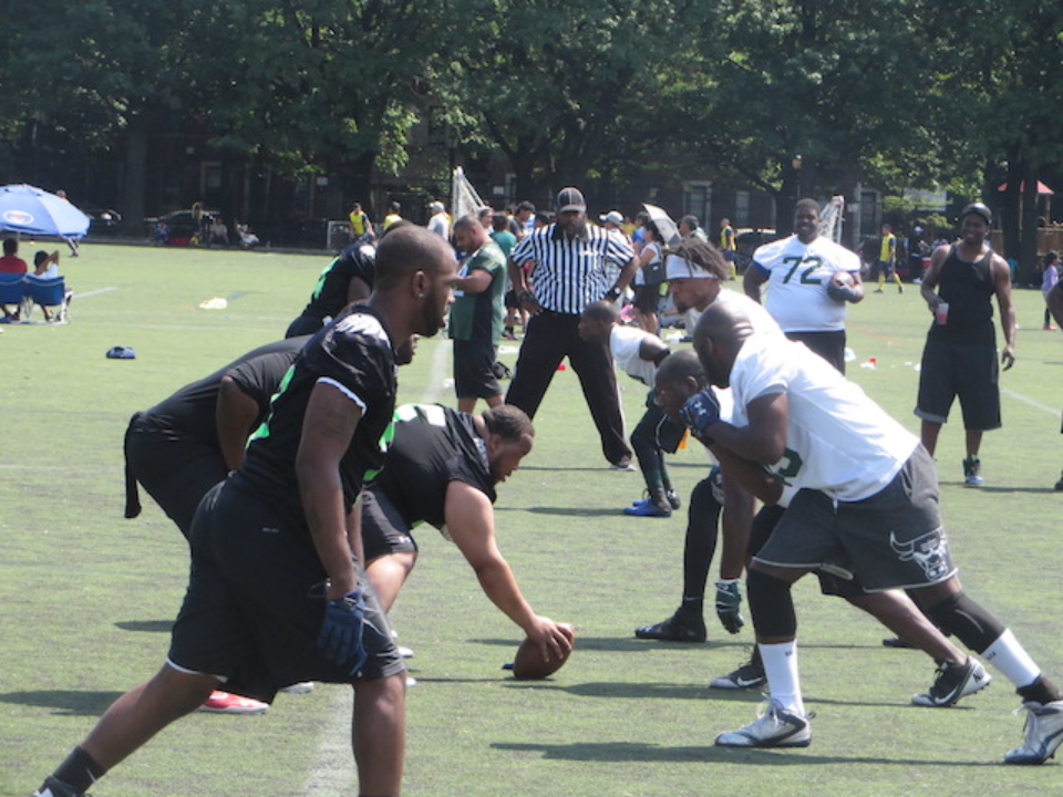 Football players facing off on field