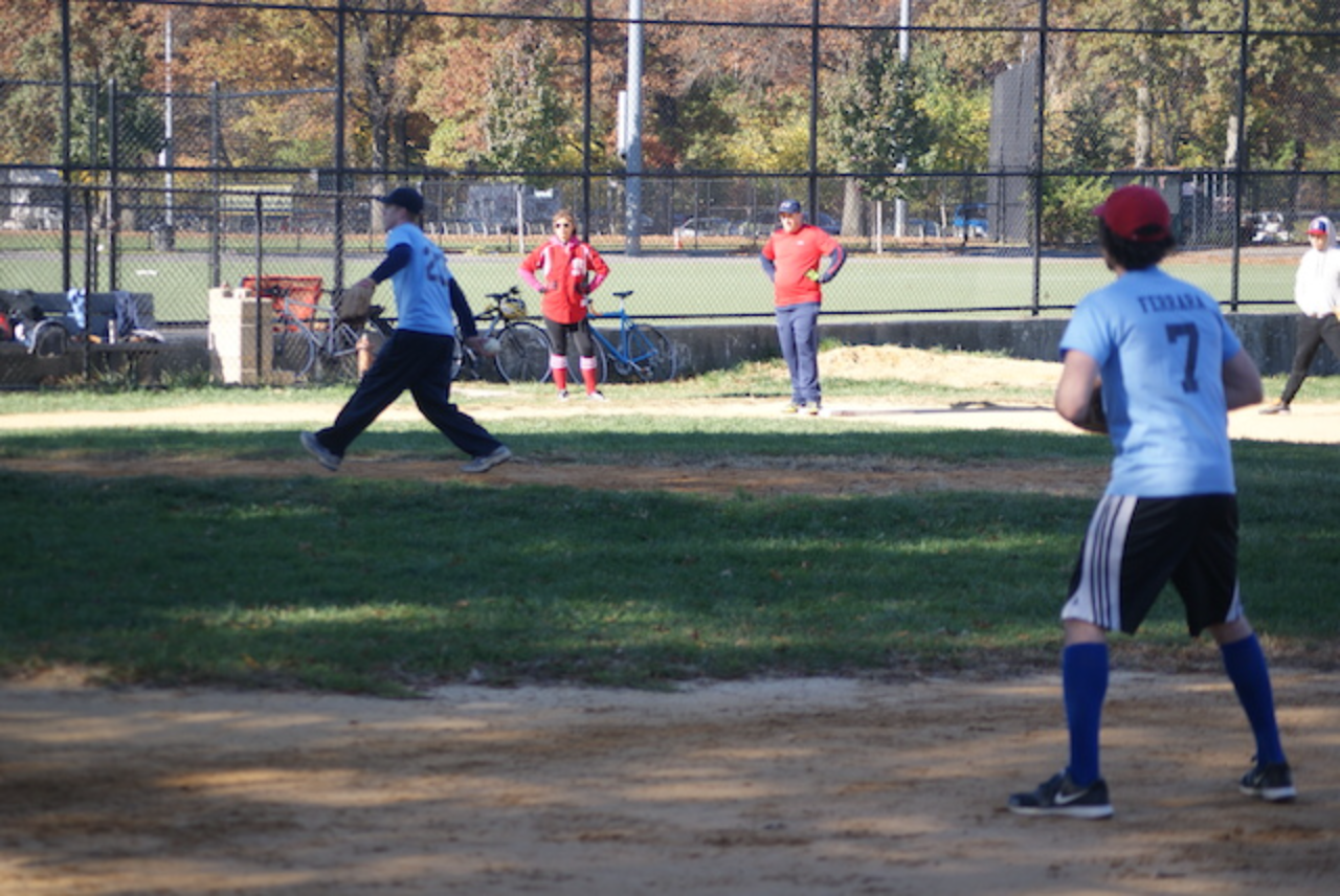 Baseball game in progress on sunny day.