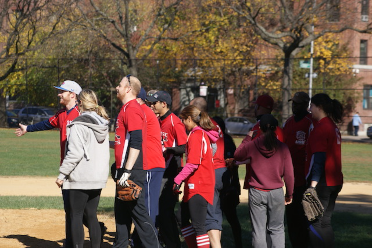 Players in red shirts on baseball field