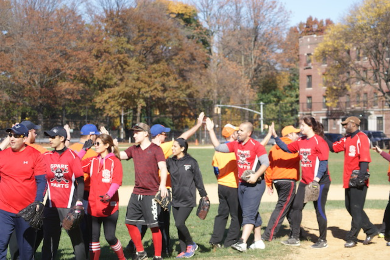 Baseball teams high-fiving after game