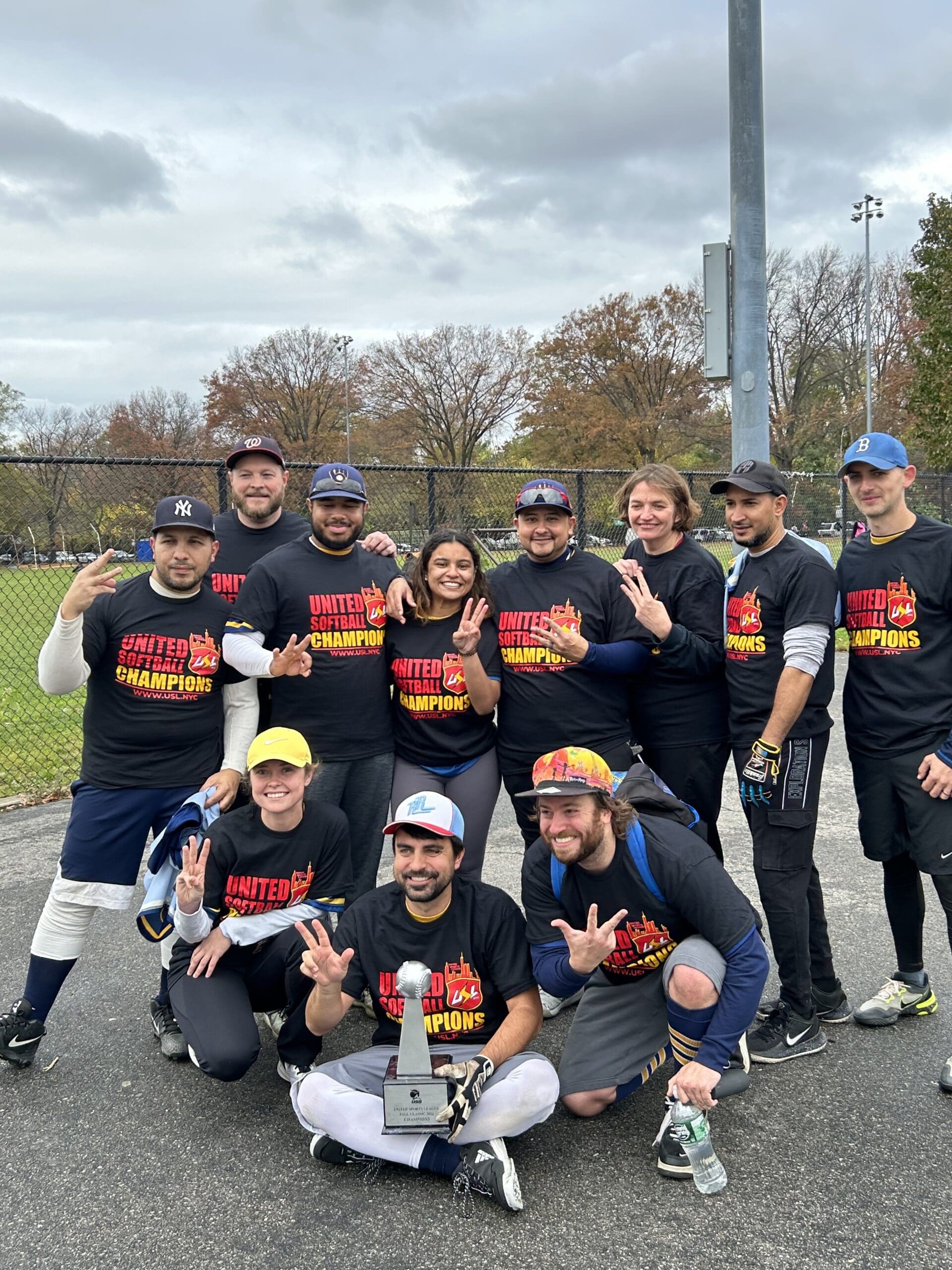 Smiling team wearing matching shirts