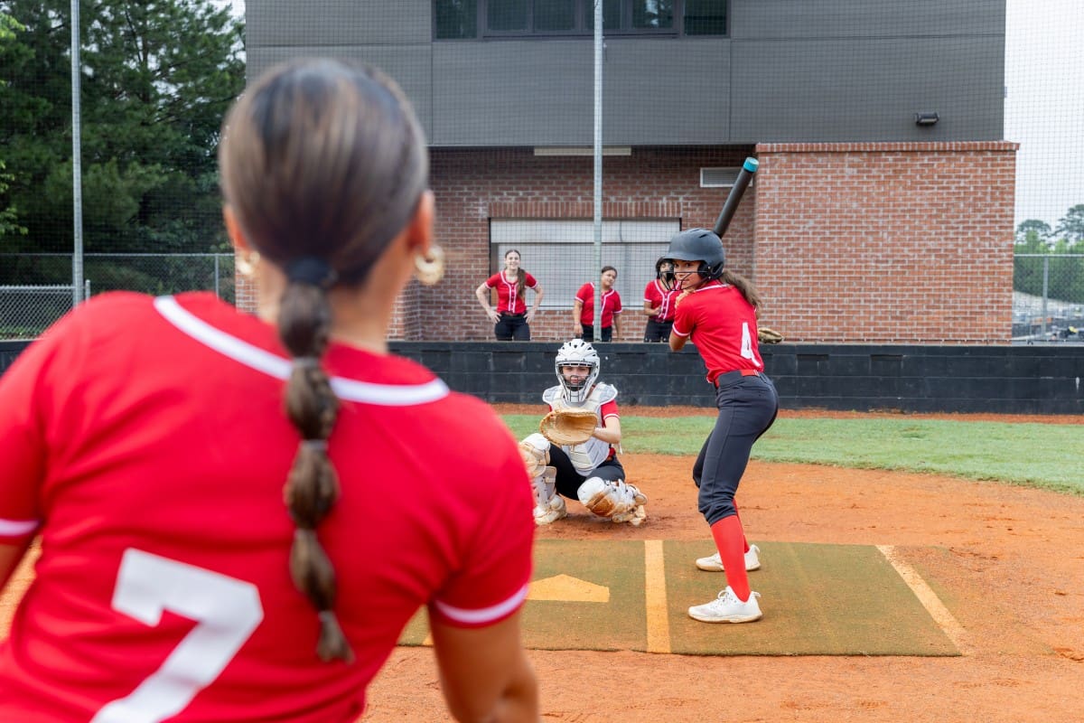 Softball player preparing to pitch