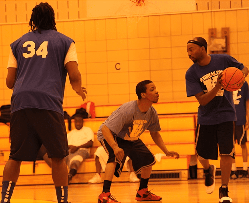 Basketball players in action on court