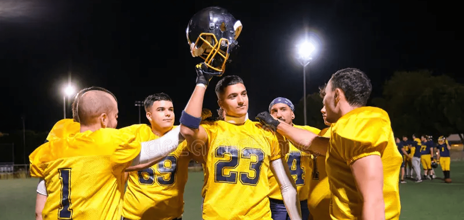 Team in yellow jerseys at night