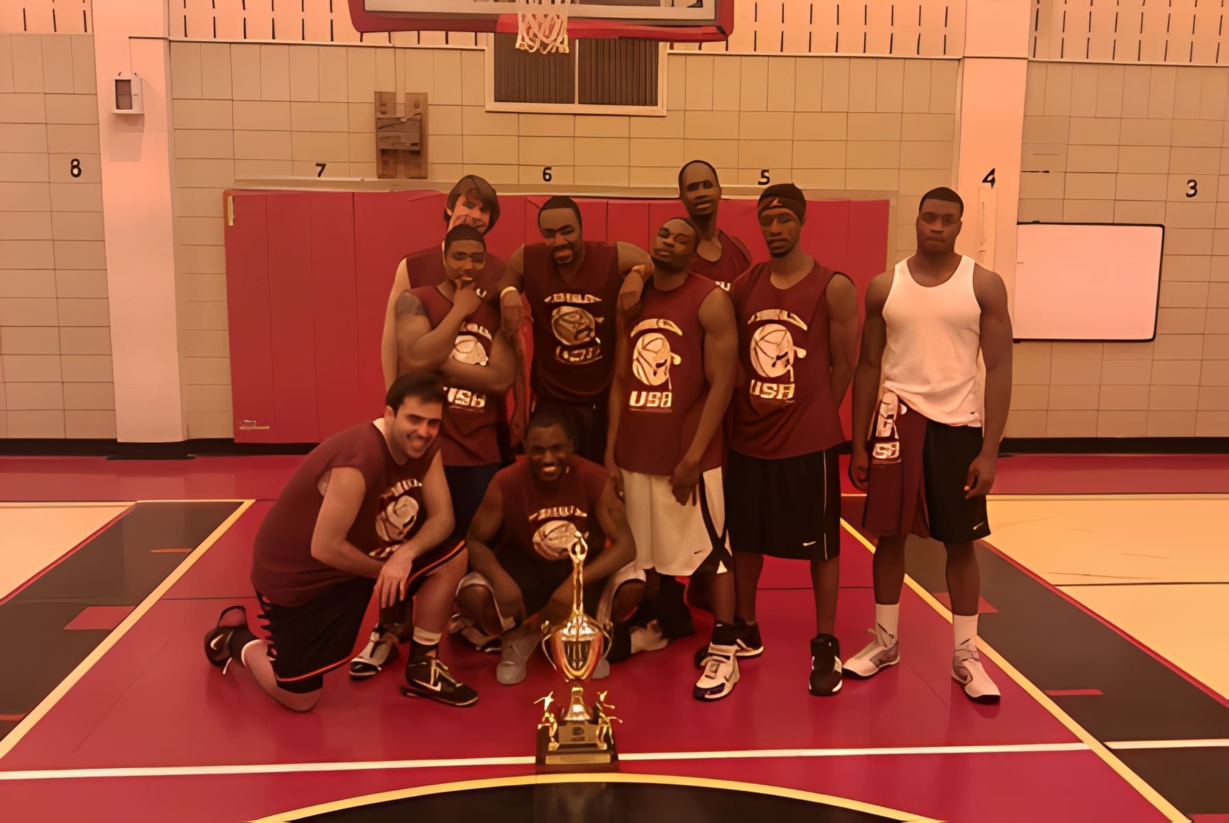 Team poses on indoor basketball court