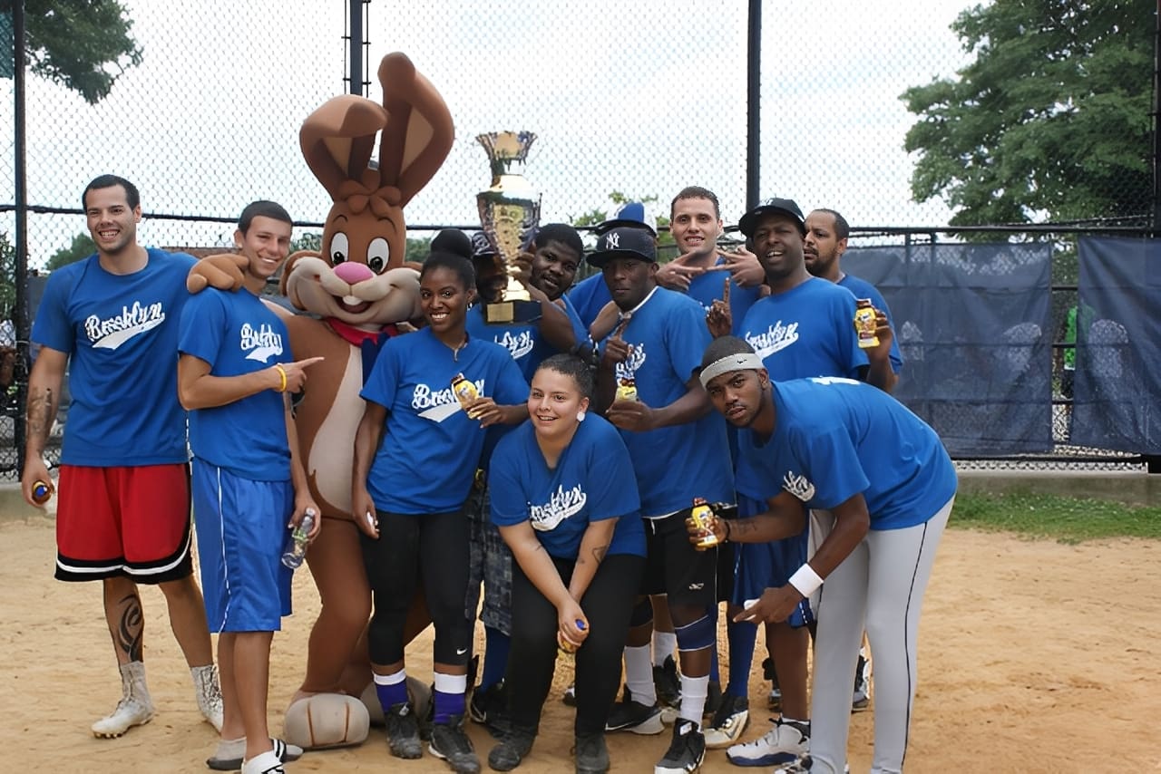 Team posing with trophy and mascot