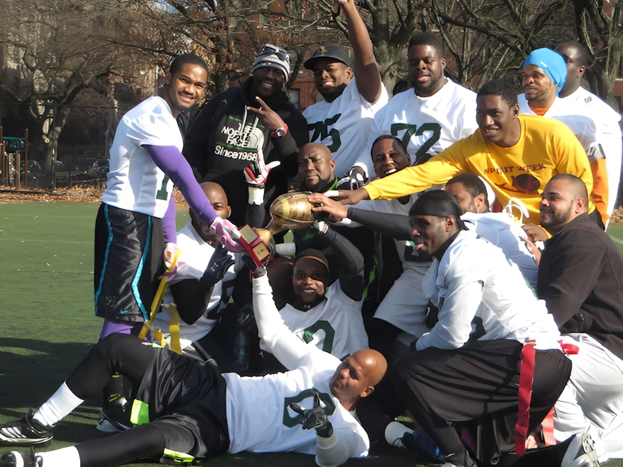 Football team posing on field