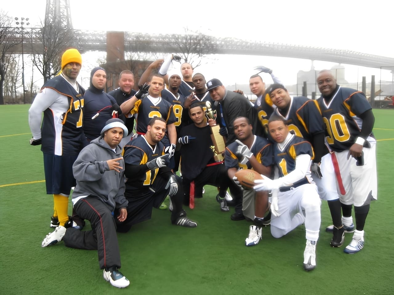Football team posing on field