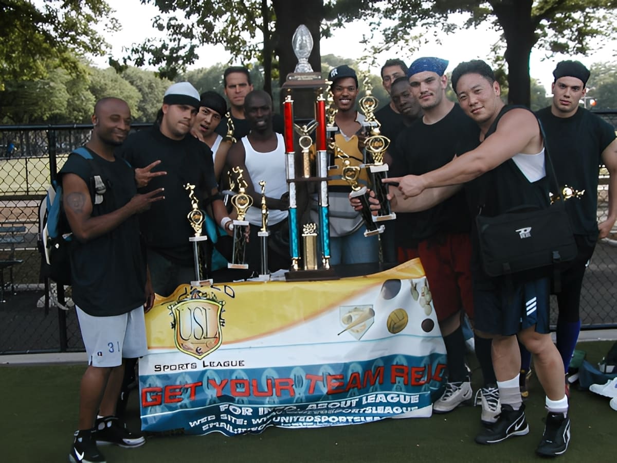 Sports team posing with awards