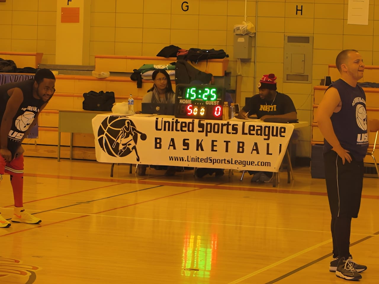 Indoor basketball game with players