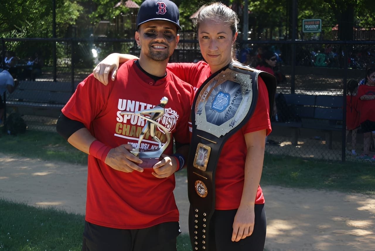 Athletes posing with championship belt