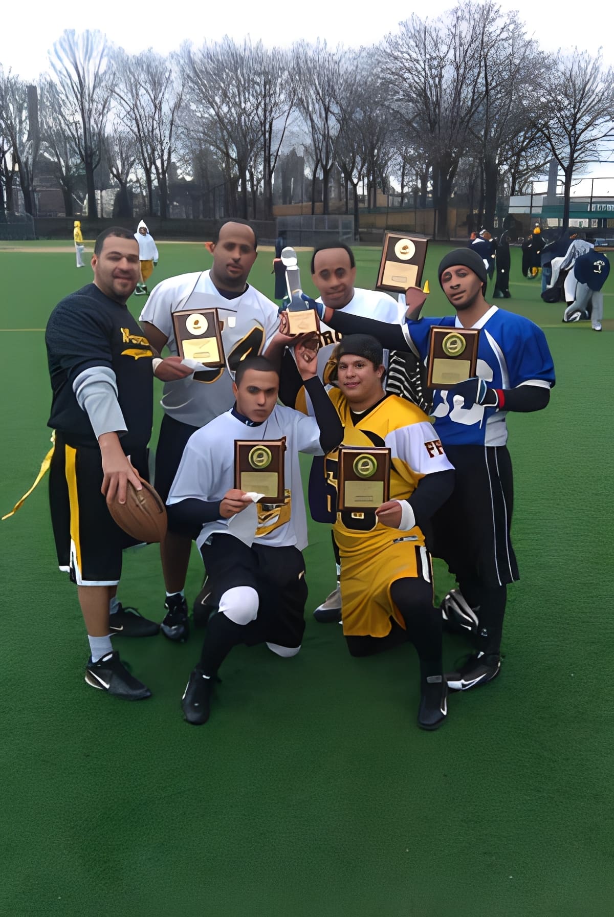 Group of athletes posing with awards
