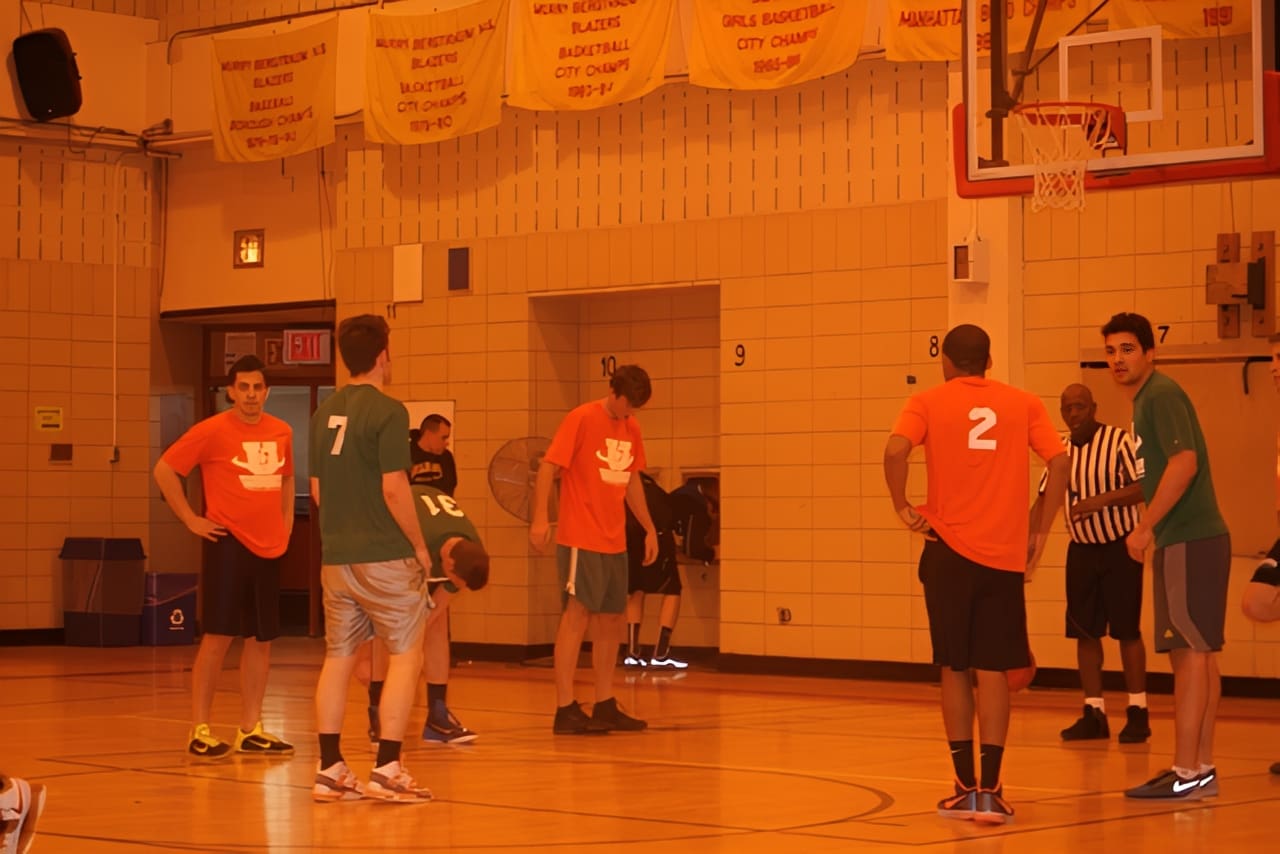 Team huddle under basketball hoop